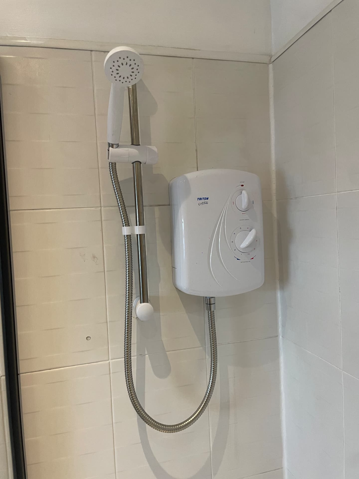 Replacement Triton electric shower fitted to existing pipework and supply