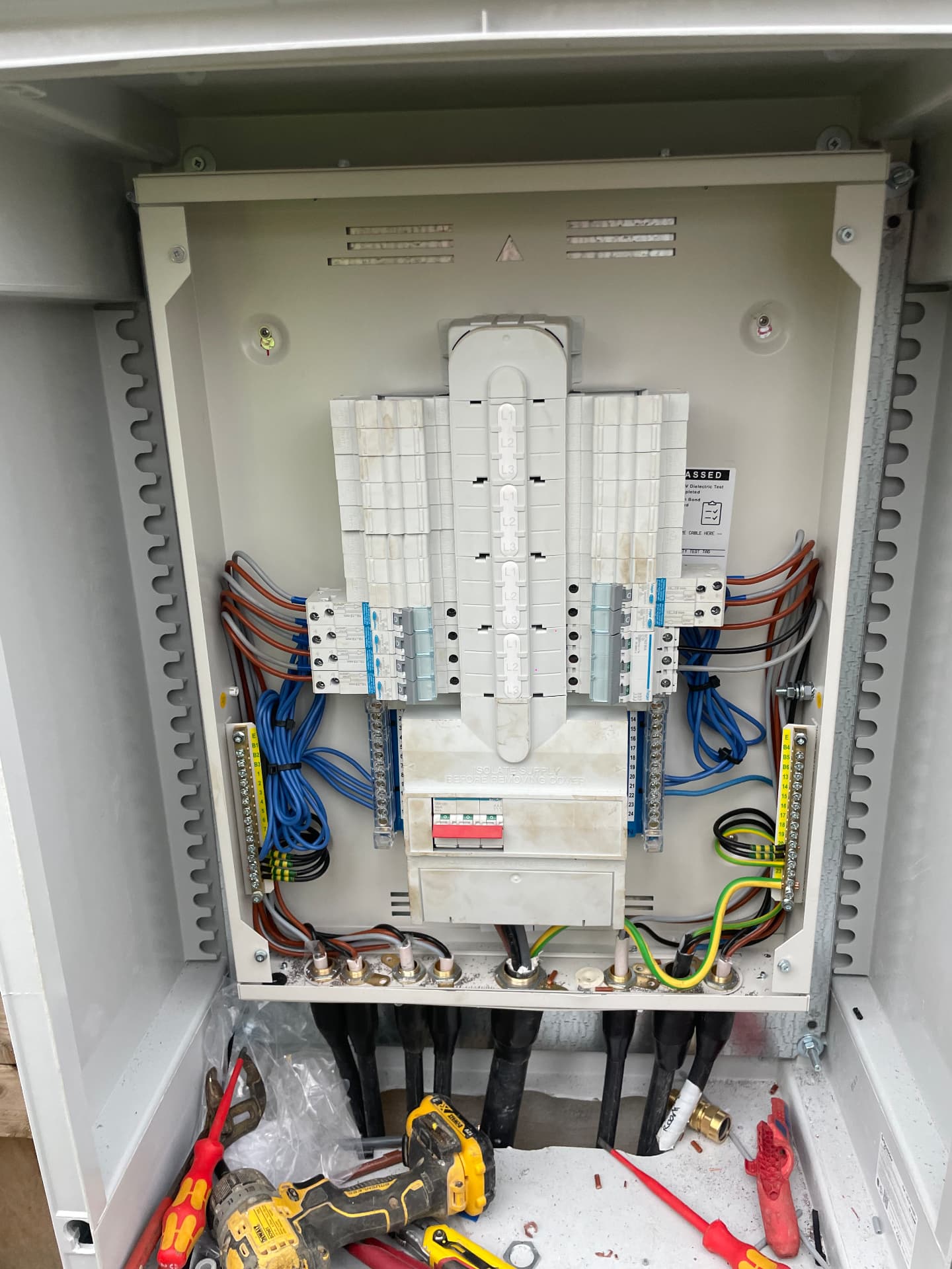 Three-phase commercial distribution panel being worked on and tested