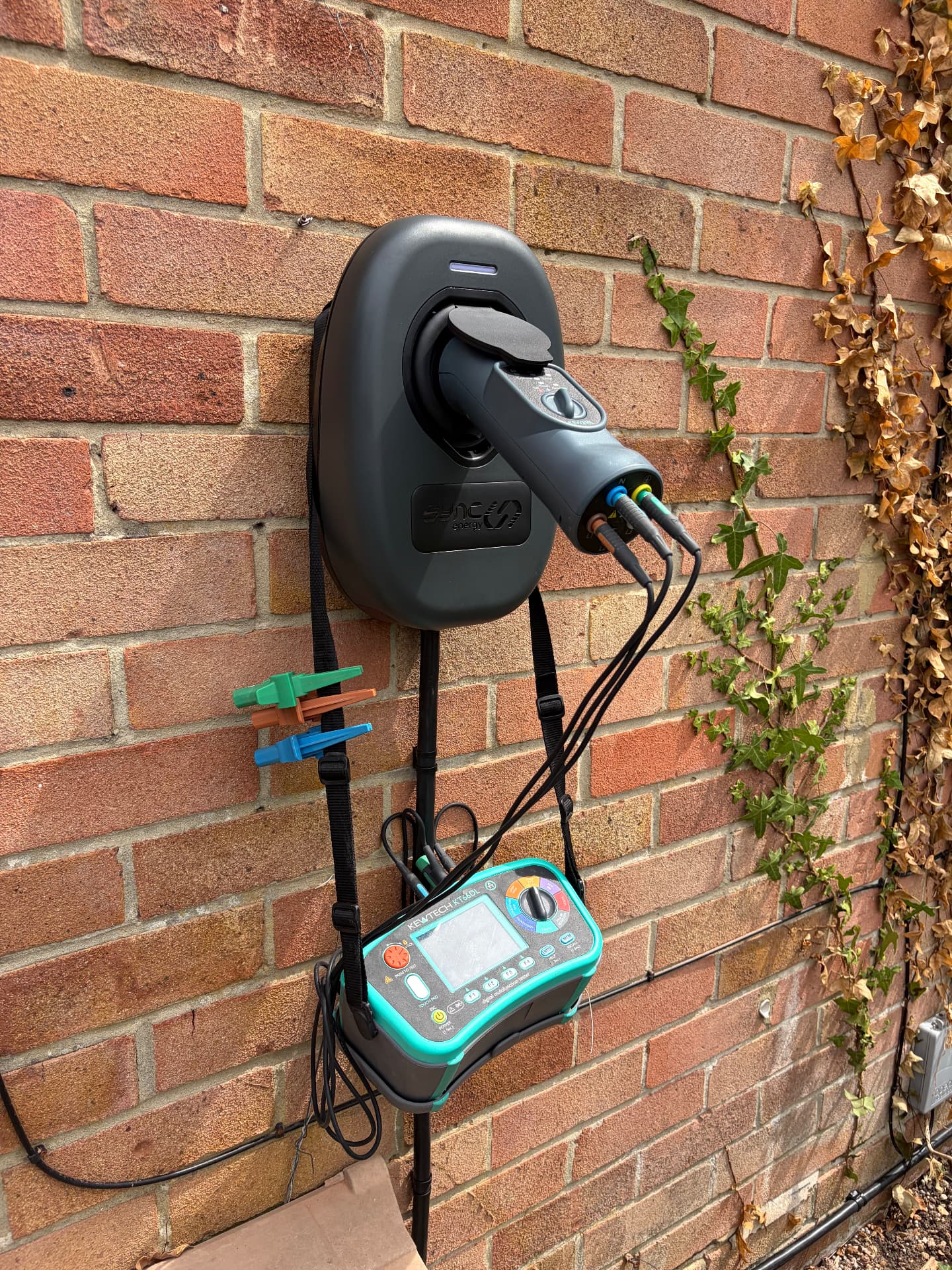 Newly installed Sync Energy EV charge point being tested on a Southampton house wall