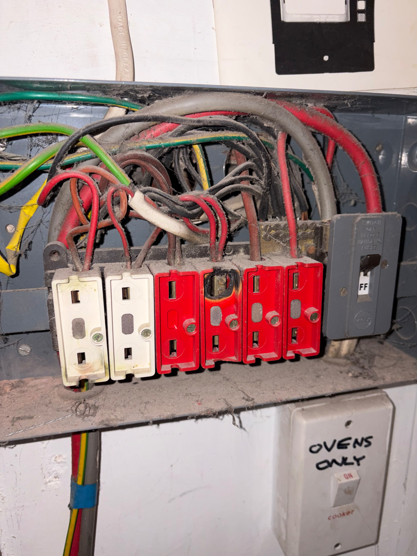 Dangerous old rewireable fuse board with signs of overheating made safe