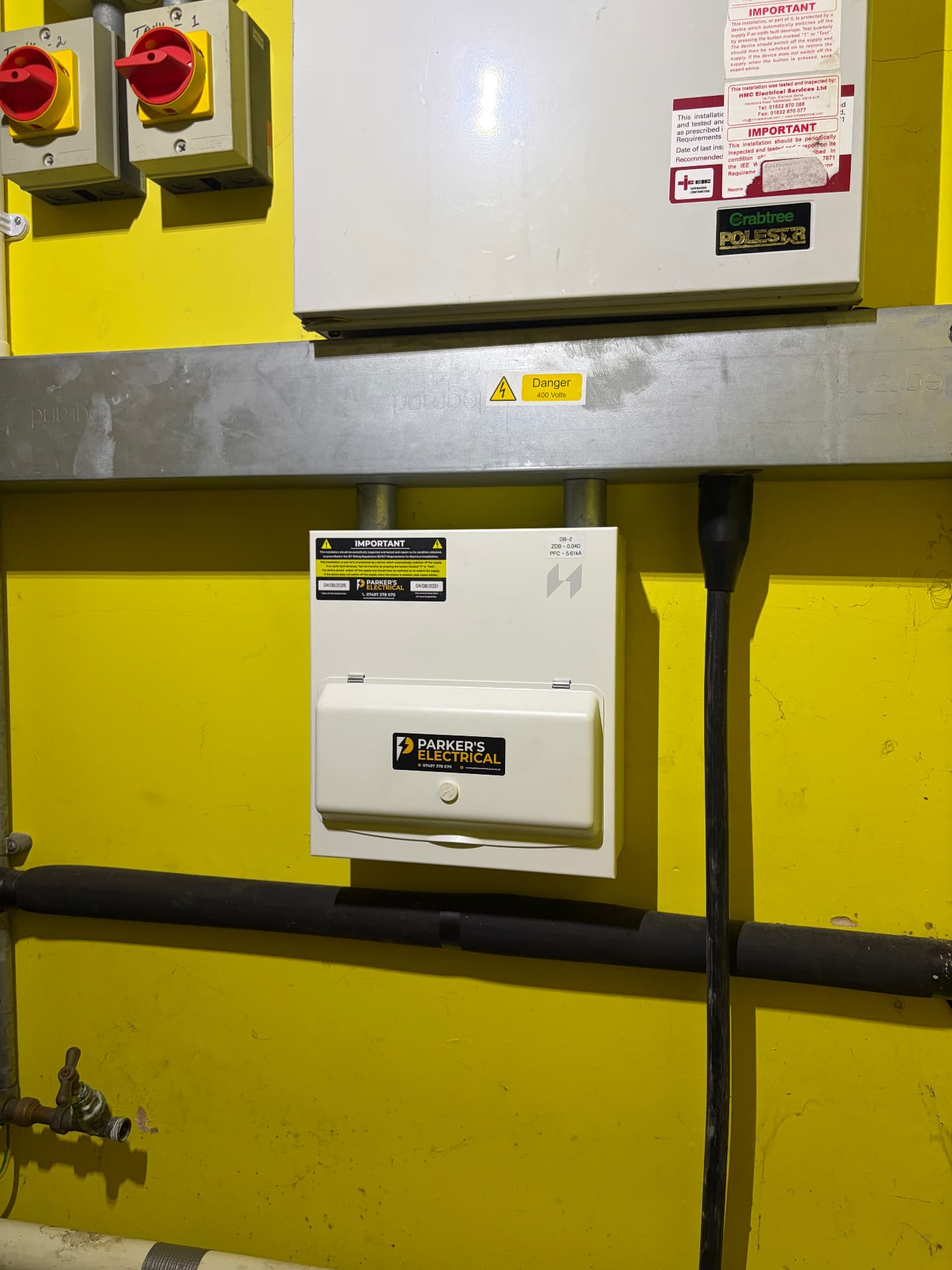 Clearly labelled three-phase distribution board in a commercial building