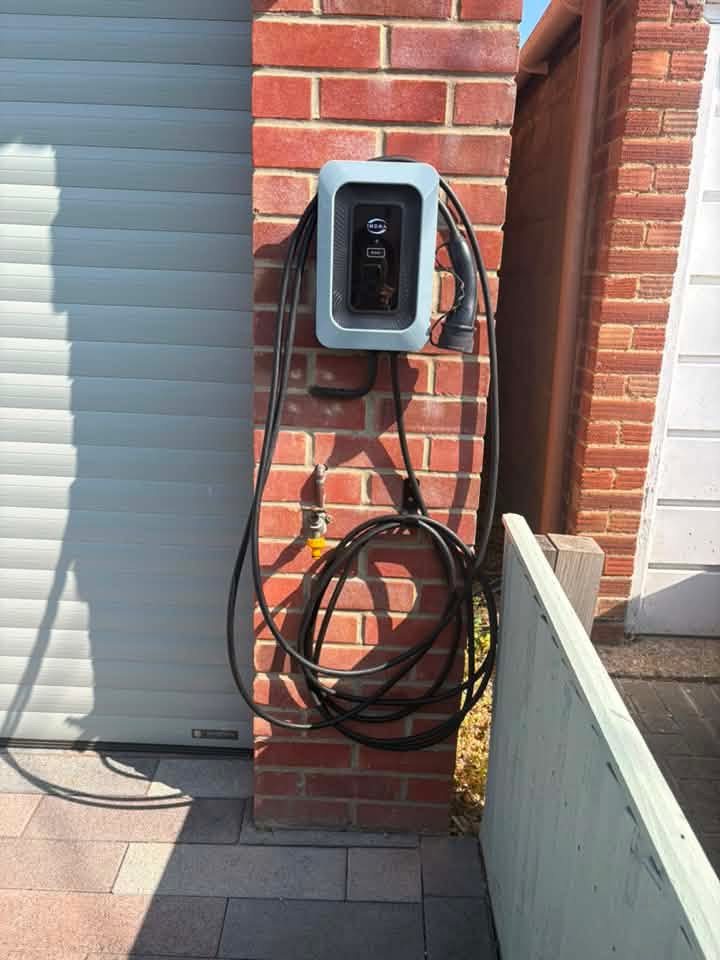 Indra EV charger installed and commissioned on a customer's house wall