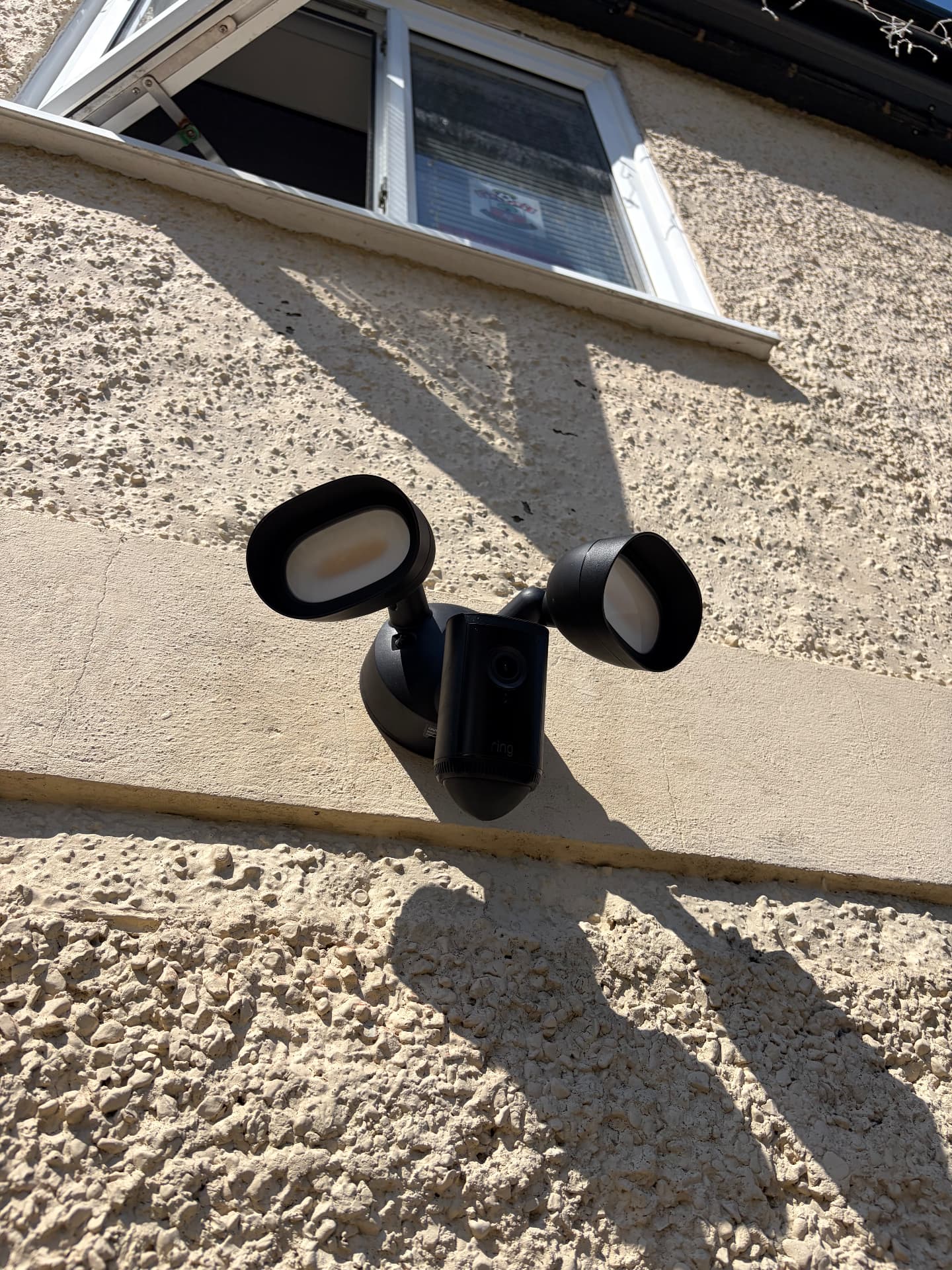 Ring floodlight camera installed on a rendered house wall in Southampton