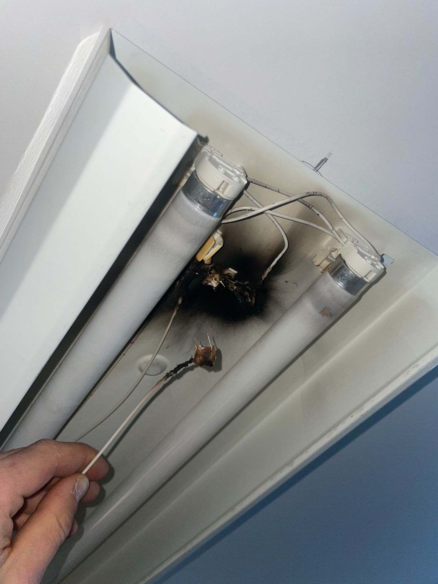 Burnt out fluorescent light fitting found on an emergency call-out