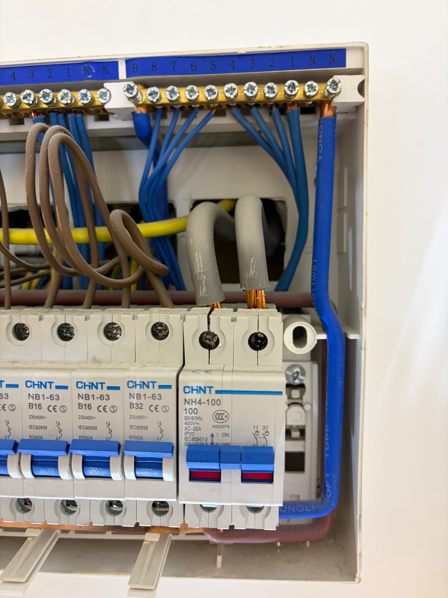 Consumer unit neutral bar inspected while splitting circuits to trace a fault
