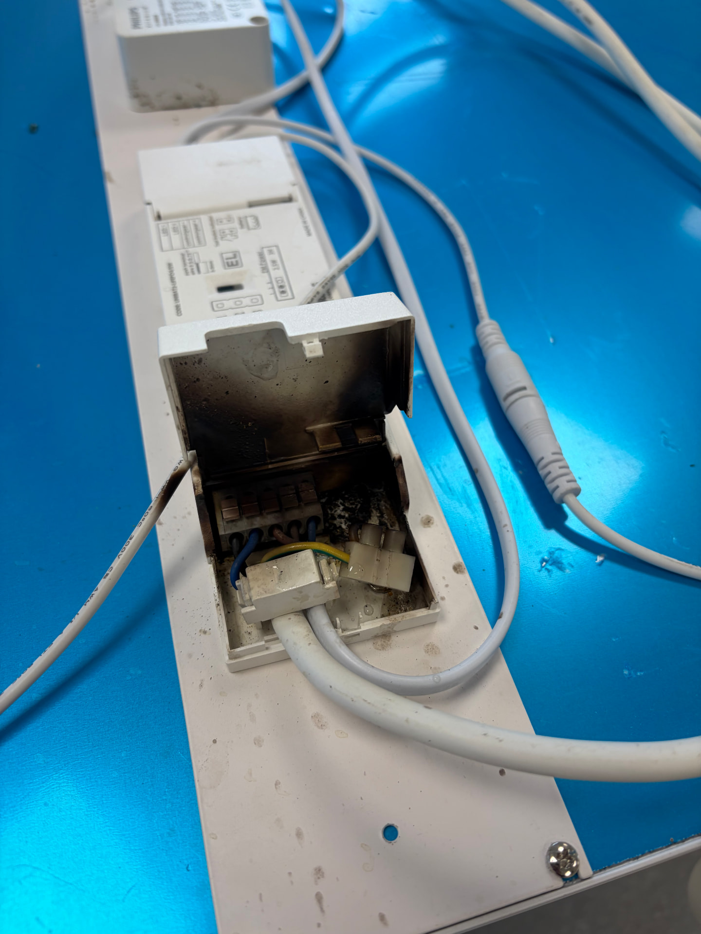 Burnt terminal block inside a light fitting found during electrical fault finding