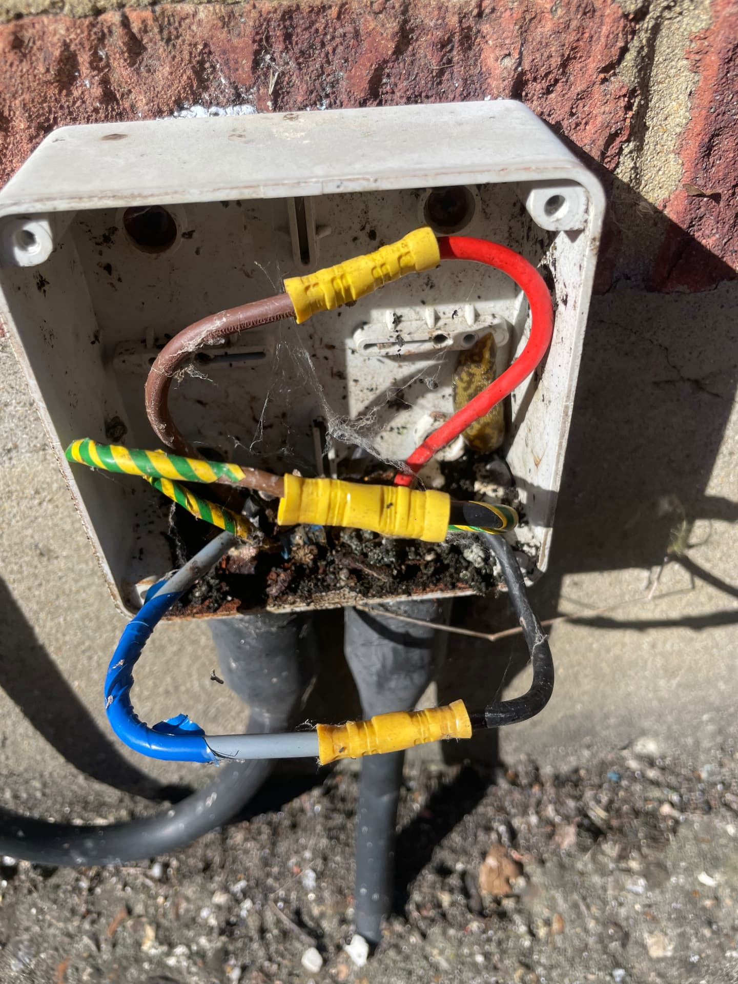 Water damaged outdoor junction box causing an earth fault and RCD tripping