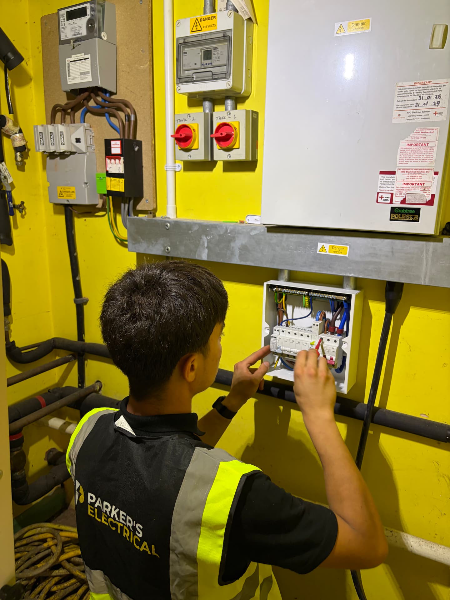 Parker's Electrical electrician working on a commercial distribution board